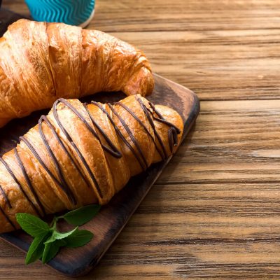 two-croissants-on-the-street-in-croissant-cafe-ins-VU7FZ3L